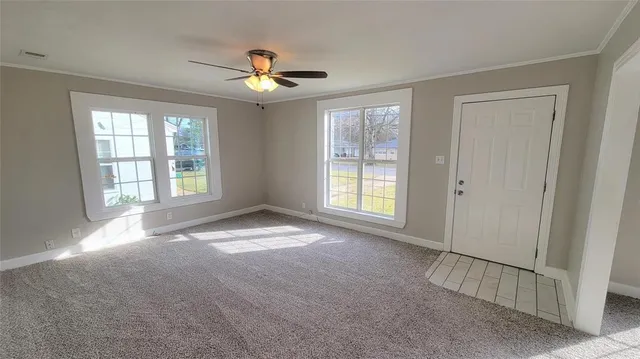 a view of an empty room with a window