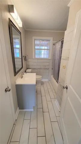 a bathroom with a sink a mirror and a bathtub
