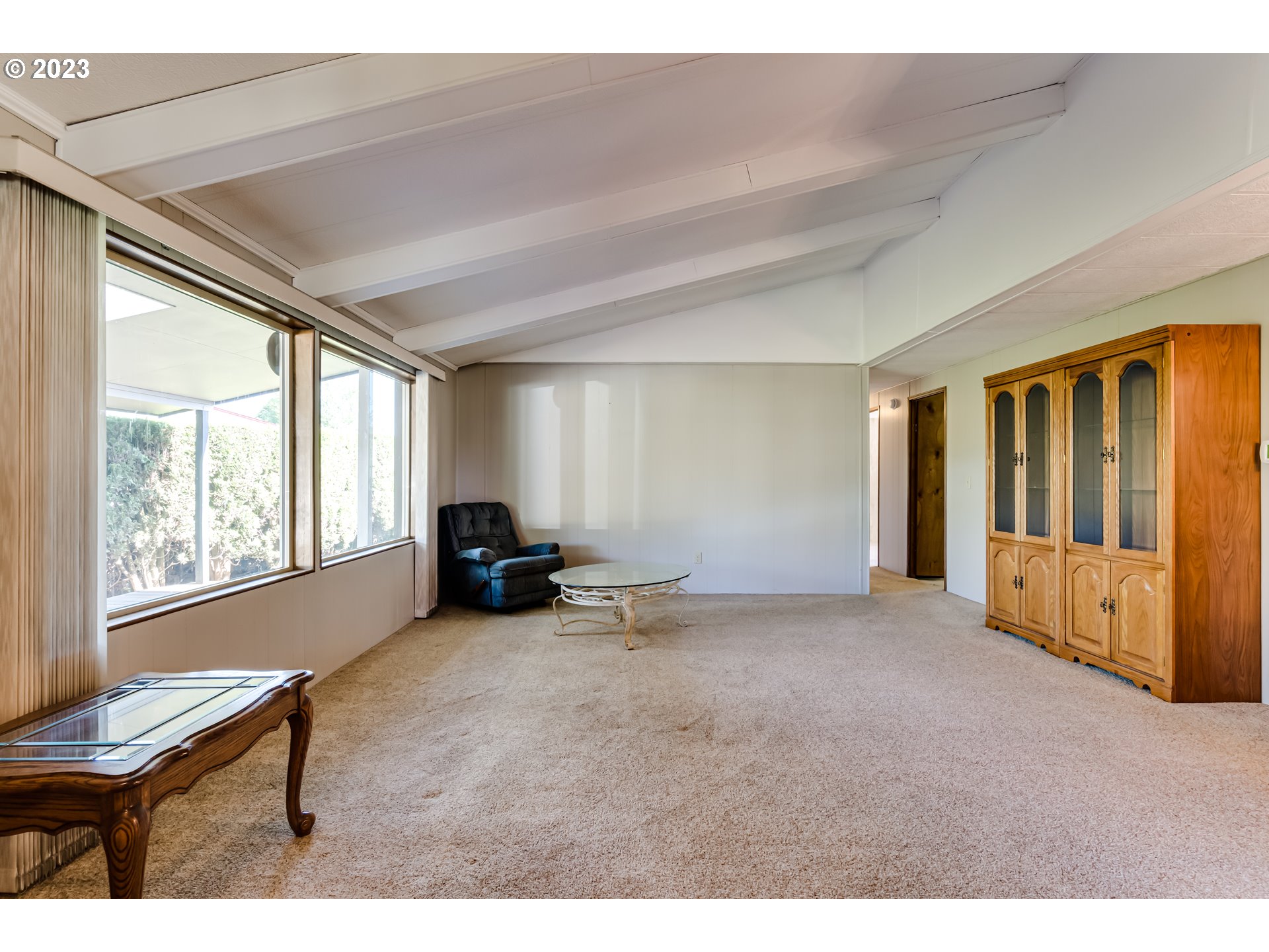 34637 Devonshire Drive Eugene, OR 97405 - Photo 11 of 37 a view of an empty room with furniture and a window