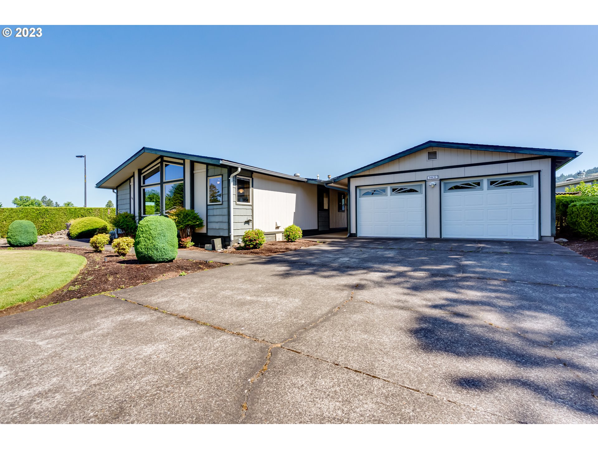 34637 Devonshire Drive Eugene, OR 97405 - Photo 36 of 37 a view of a house with a yard and garage