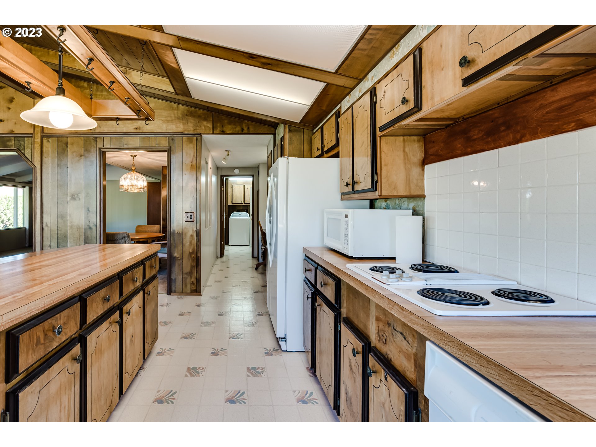 34637 Devonshire Drive Eugene, OR 97405 - Photo 5 of 37 a kitchen with stainless steel appliances granite countertop a sink a stove and a refrigerator