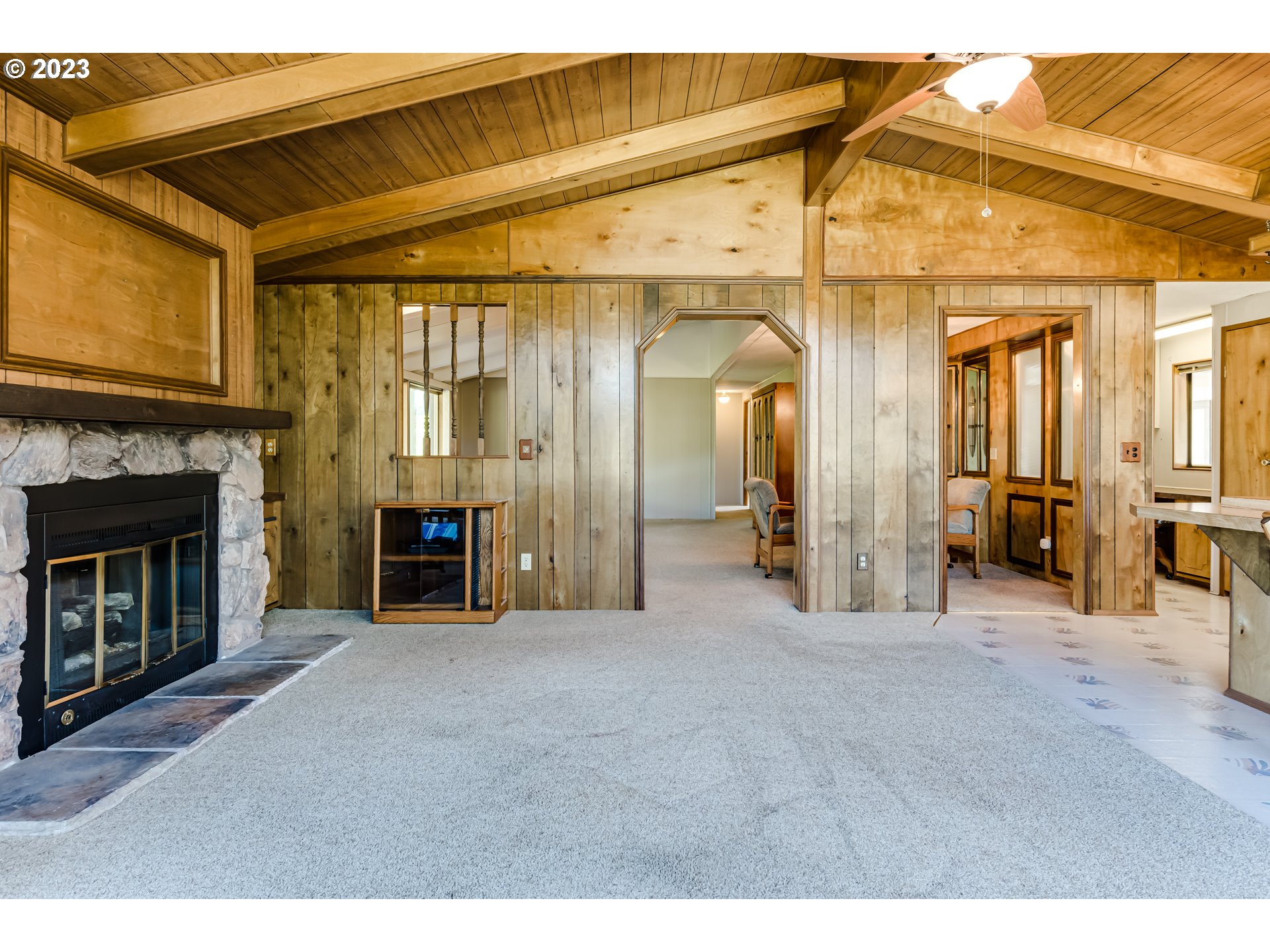 34637 Devonshire Drive Eugene, OR 97405 - Photo 9 of 37 a view of a livingroom with a fireplace and cabinet