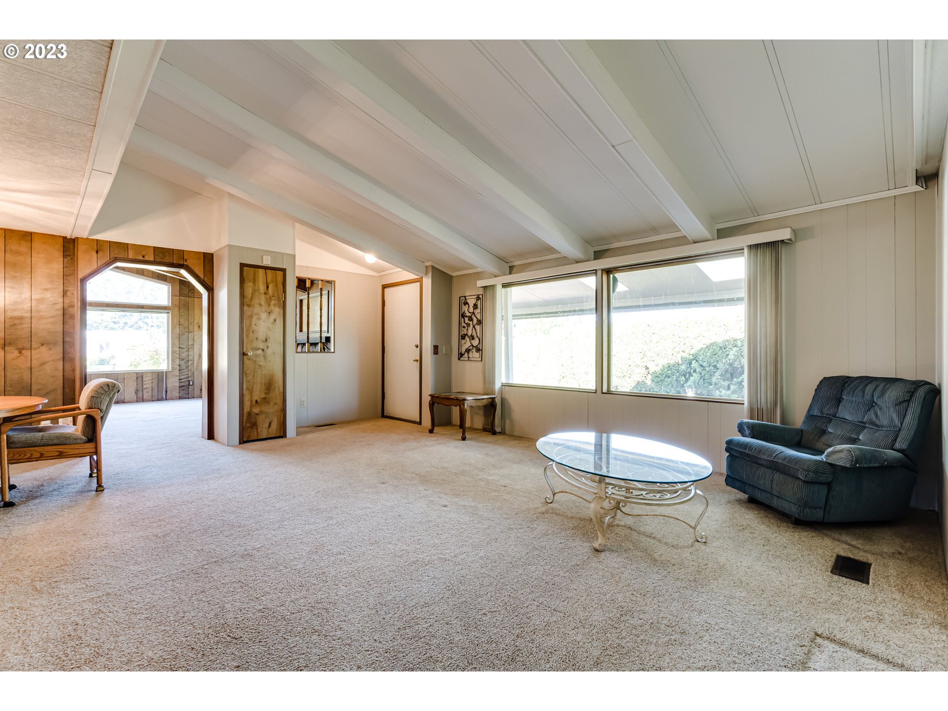 34637 Devonshire Drive Eugene, OR 97405 - Photo 10 of 37 a living room with furniture and a large window