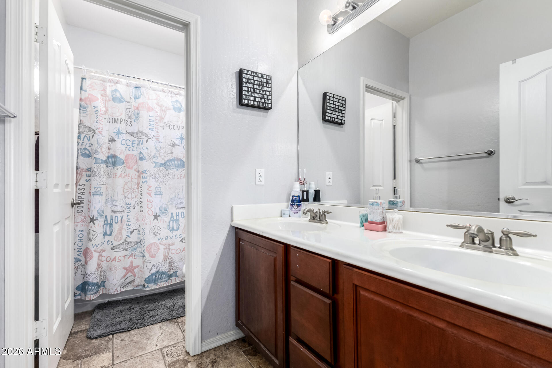 24541 Plum Road Florence, AZ 85132 - Photo 25 of 47 a bathroom with a double vanity sink mirror and shower