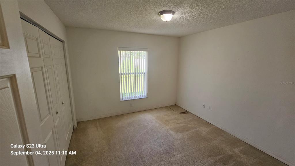 33 Fenwick Lane Palm Coast, FL 32137 - Photo 11 of 16 an empty room with windows