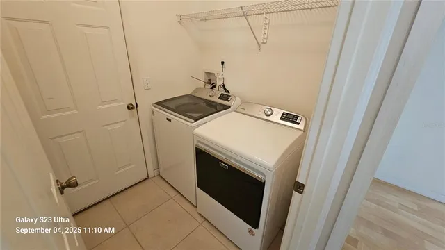 a utility room with dryer and washer