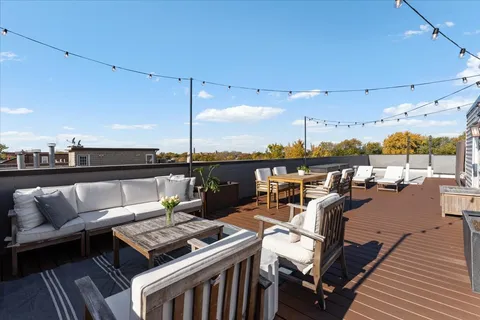 a roof deck with patio