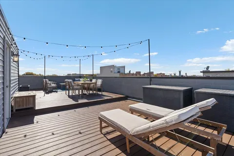 a view of a balcony with two chairs