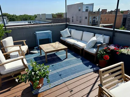 a view of outdoor living space with furniture