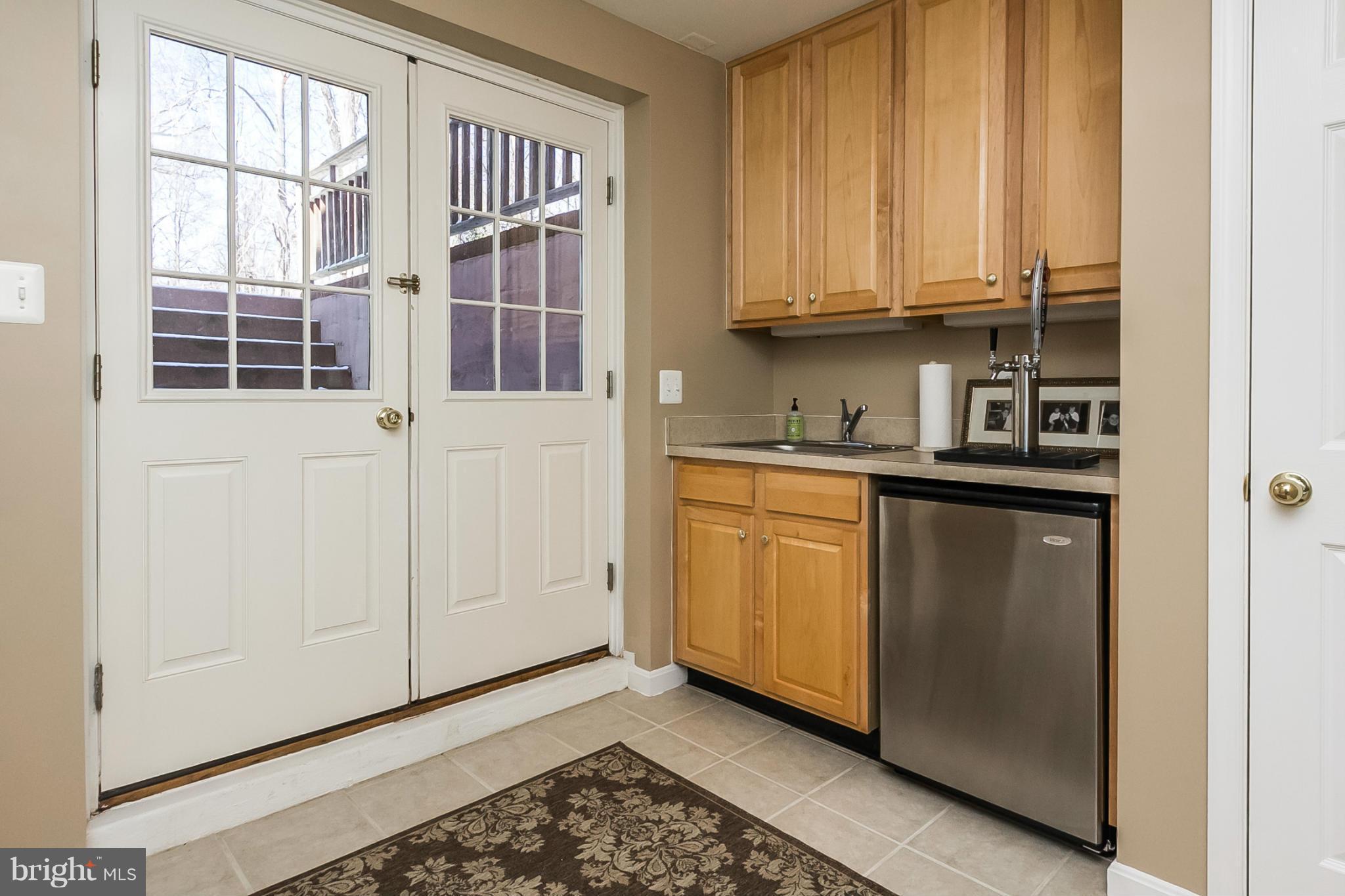 14514 Old York Road Phoenix, MD 21131 - Photo 22 of 24 a kitchen with stainless steel appliances granite countertop a sink and cabinets with wooden floor