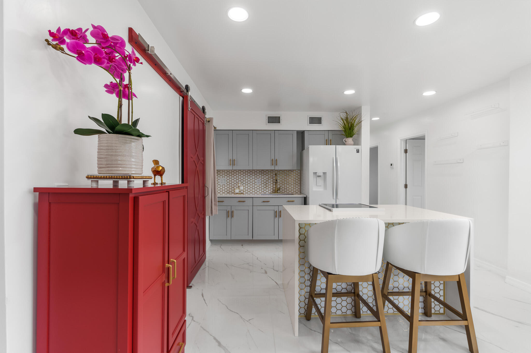 201 Northeast 28th Court Boynton Beach, FL 33435 - Photo 12 of 48 a kitchen with white cabinets and refrigerator