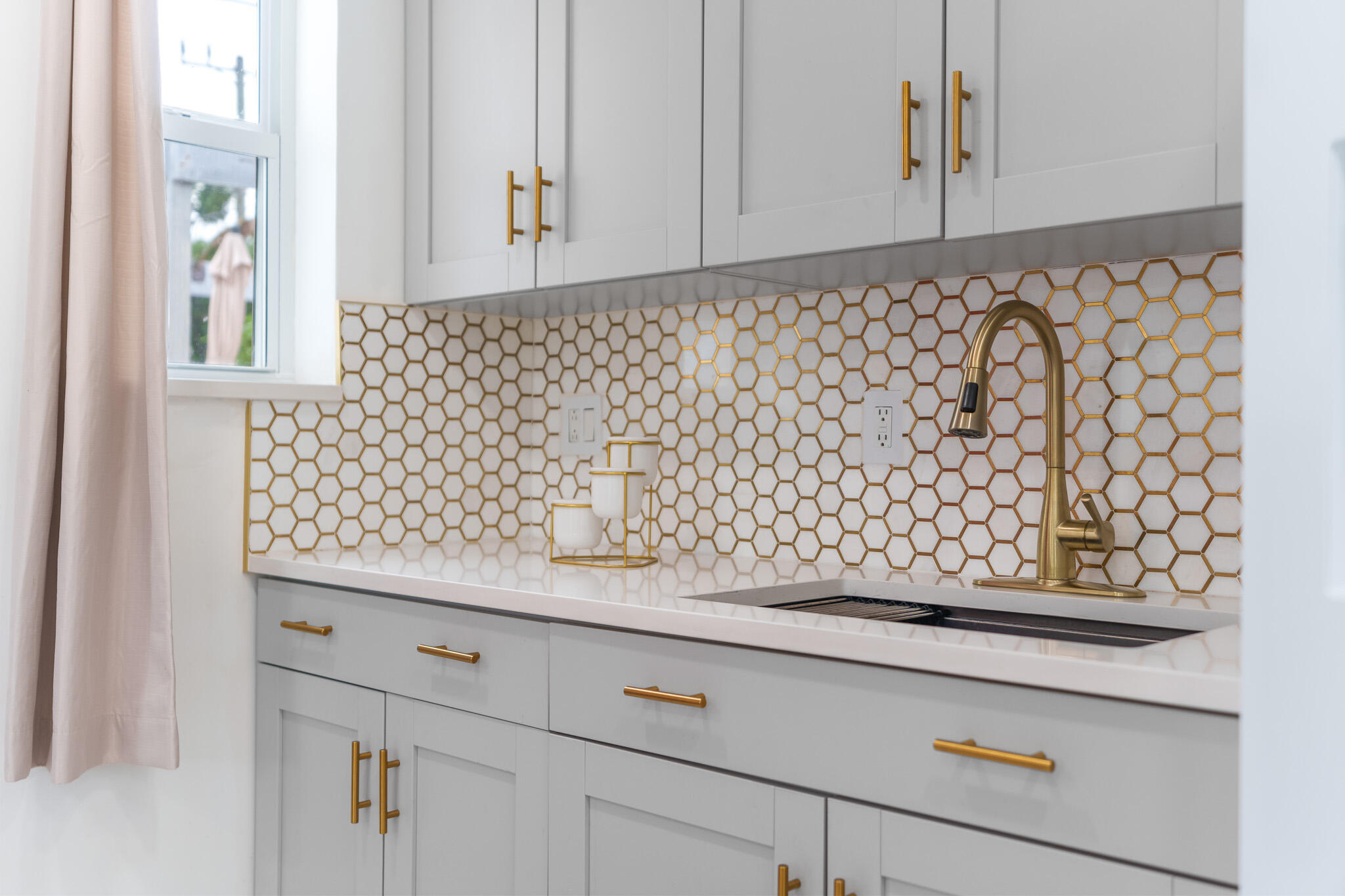 201 Northeast 28th Court Boynton Beach, FL 33435 - Photo 13 of 48 a view of wooden cabinets and a sink
