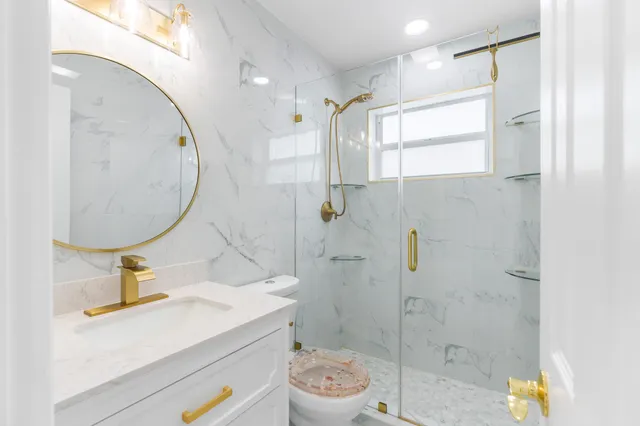 a view of a house with a yard and potted plants