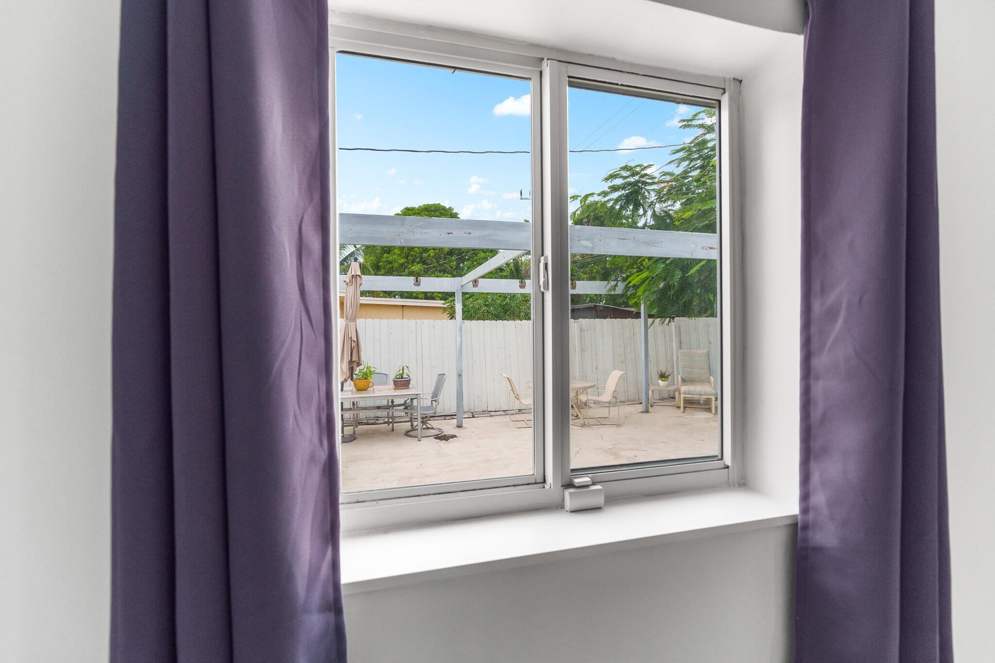201 Northeast 28th Court Boynton Beach, FL 33435 - Photo 31 of 48 a view of a room that has a bed and a window