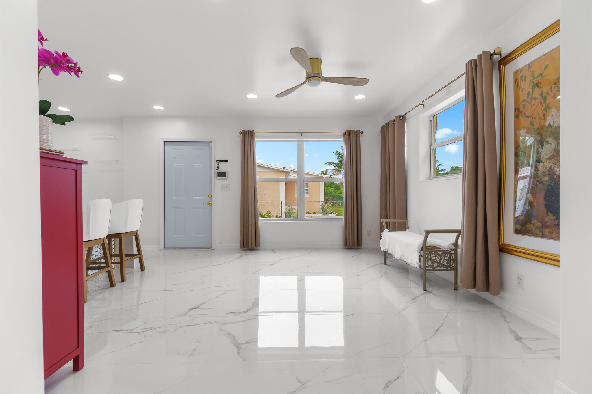 201 Northeast 28th Court Boynton Beach, FL 33435 - Photo 4 of 48 a living room with furniture and a large window