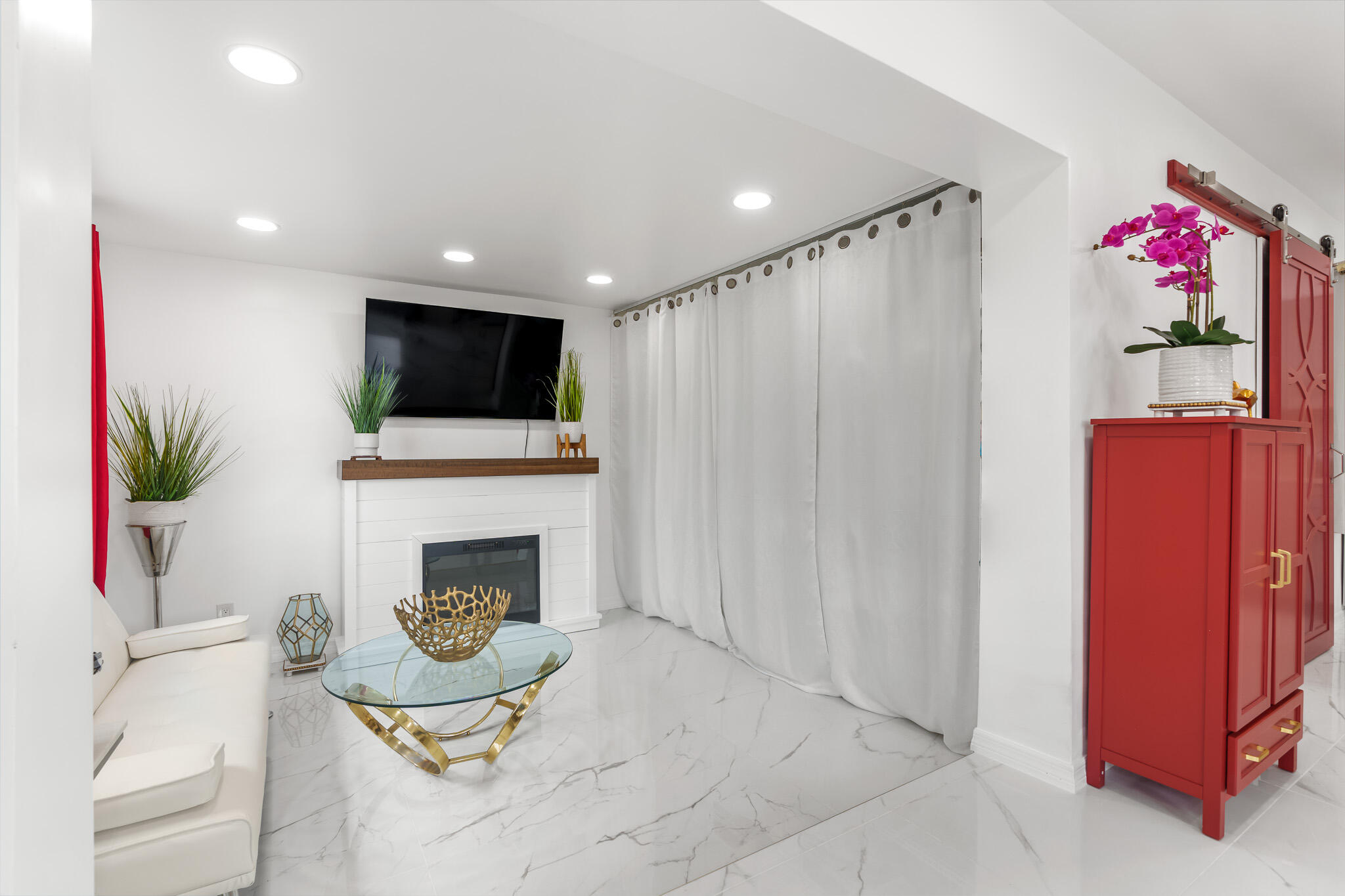 201 Northeast 28th Court Boynton Beach, FL 33435 - Photo 7 of 48 a living room with furniture fireplace and flat screen tv