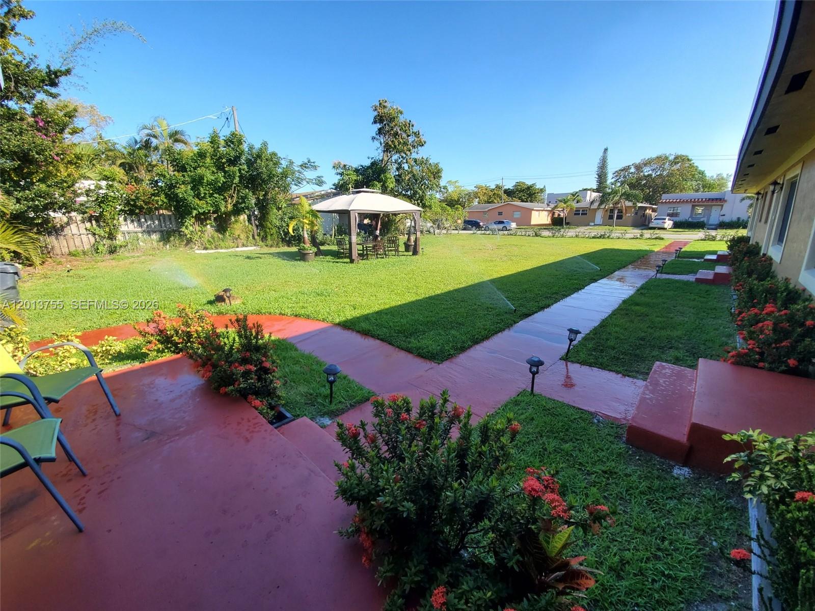 2015 Funston Street, Unit 2 Hollywood, FL 33020 - Photo 16 of 19 a view of a yard with plants and large trees