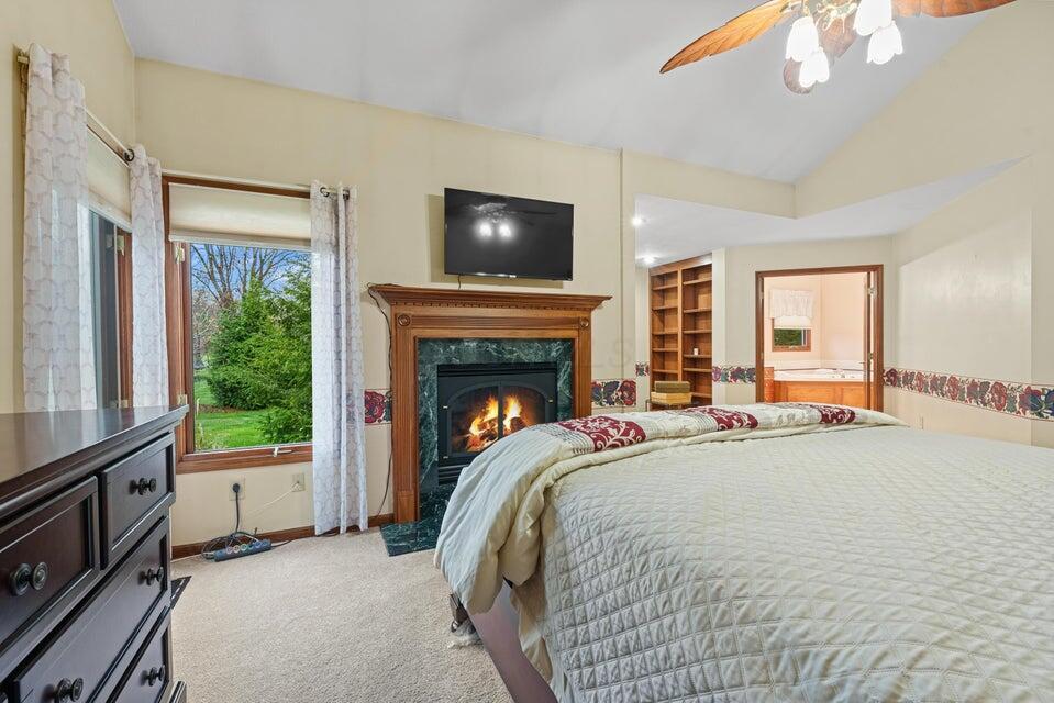 9909 Hoover Woods Road Galena, OH 43021 - Photo 22 of 50 Fireplace in owner suite