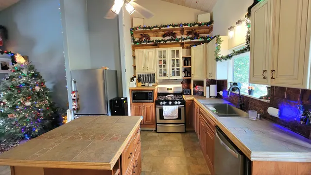a bedroom with furniture and a flat screen tv