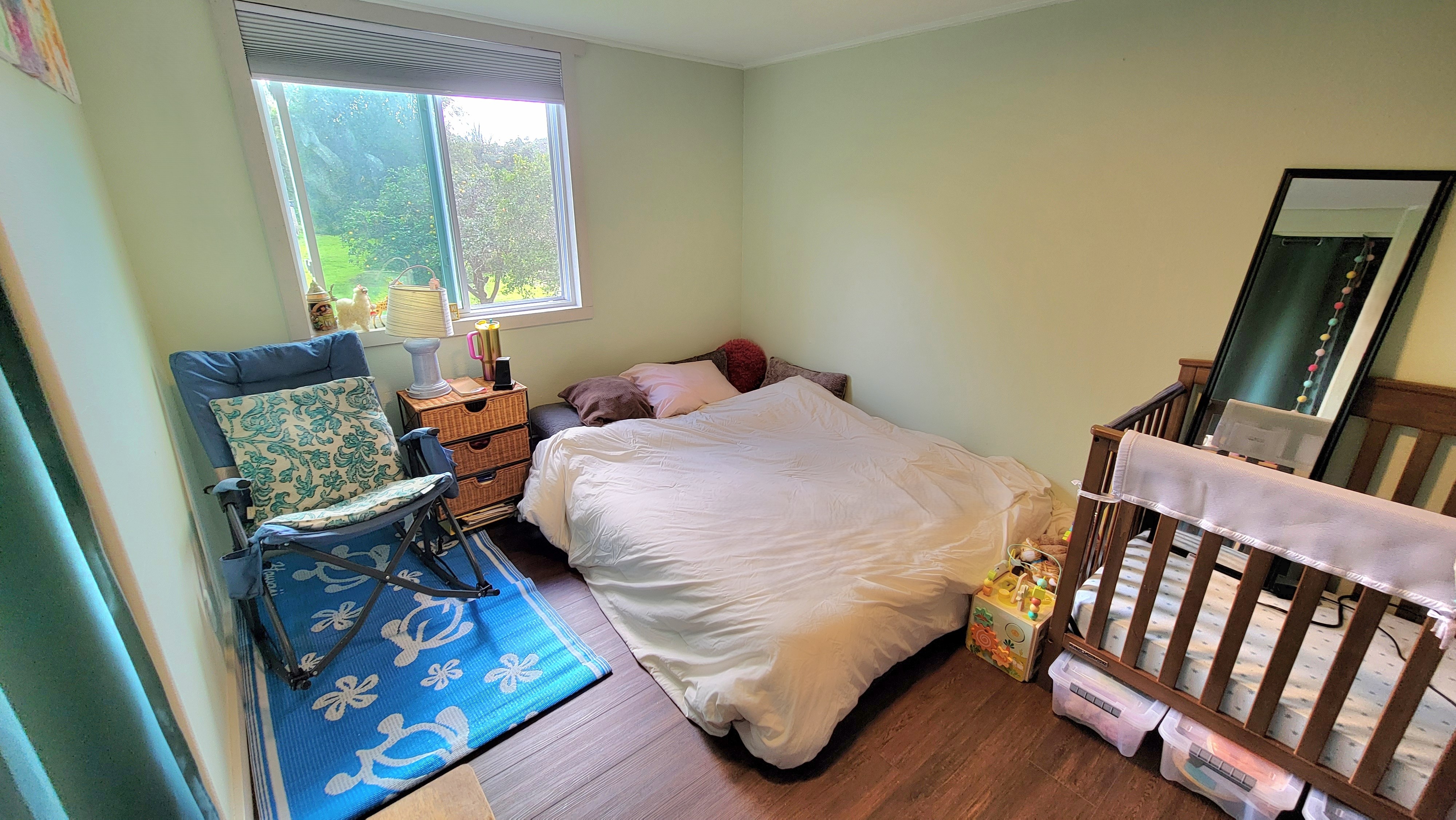 78-1392 Bishop Road Holualoa, HI 96725 - Photo 19 of 30 a bedroom with a bed and wooden floor