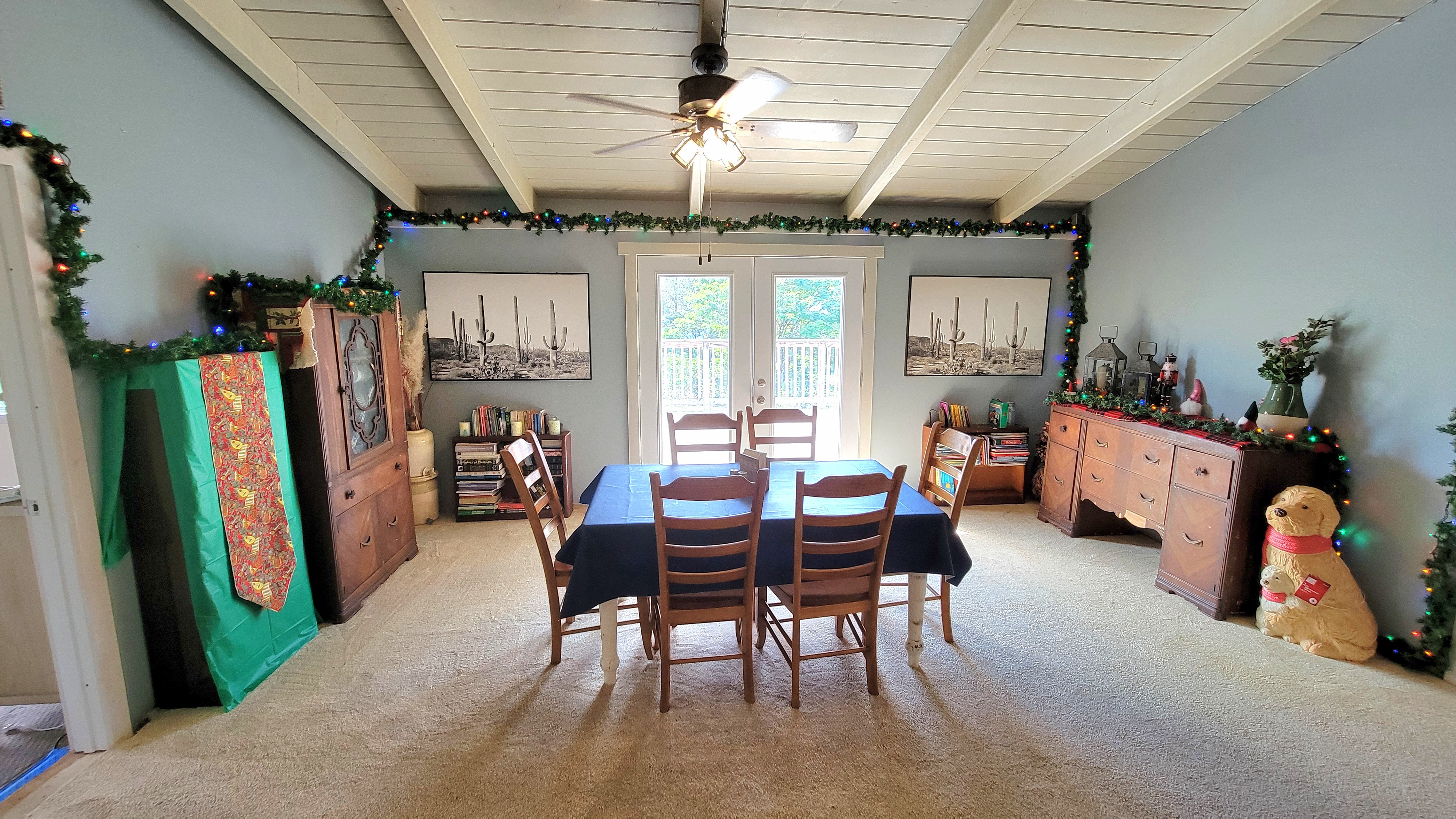 78-1392 Bishop Road Holualoa, HI 96725 - Photo 7 of 30 a view of a dining room with furniture and a chandelier