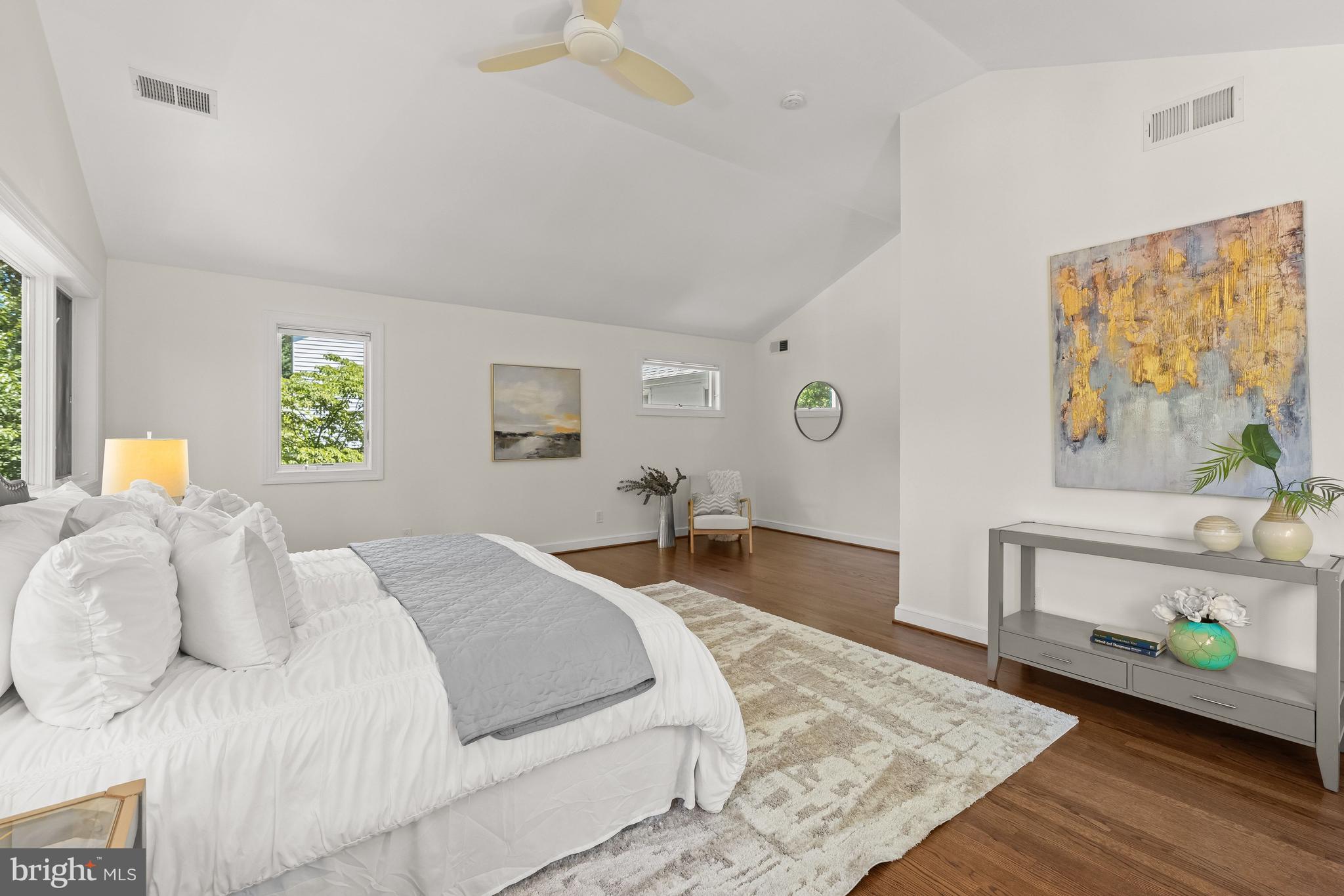 8800 Maywood Avenue Silver Spring, MD 20910 - Photo 24 of 41 a bedroom with a bed and wooden floor