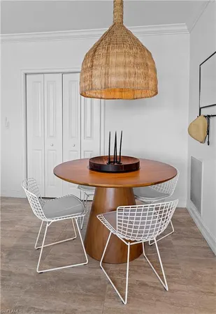 a kitchen with a dining table and chairs
