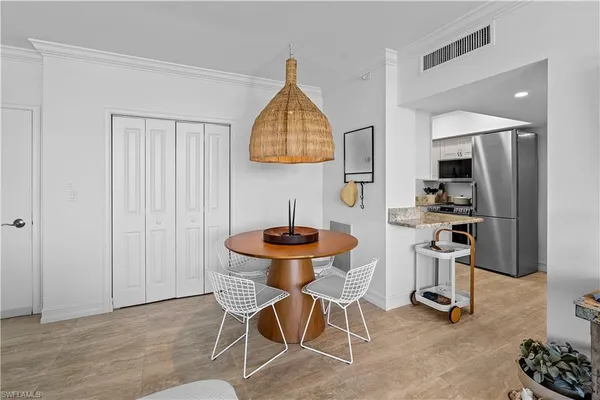 a kitchen with granite countertop a sink a stove and cabinets