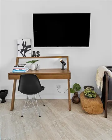 a bedroom with a workspace