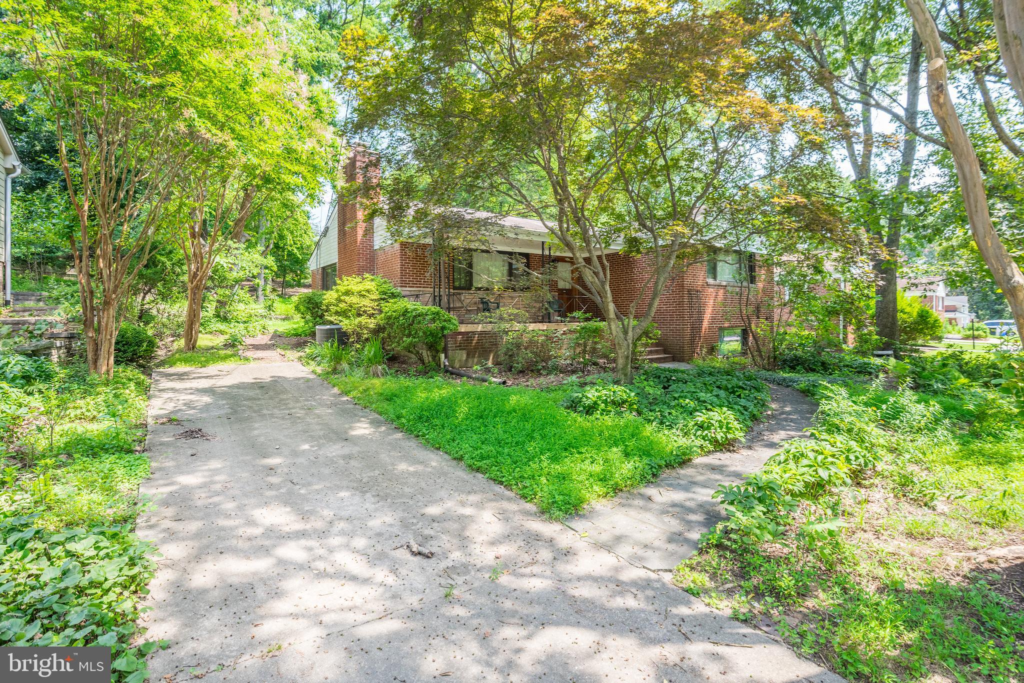 10407 Royal Road Silver Spring, MD 20903 - Photo 2 of 33 a front view of a house with garden