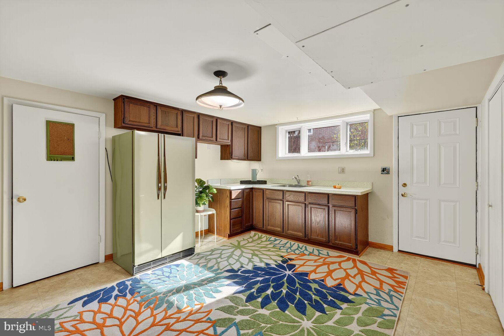 10407 Royal Road Silver Spring, MD 20903 - Photo 22 of 33 a bedroom with a bed and cabinets