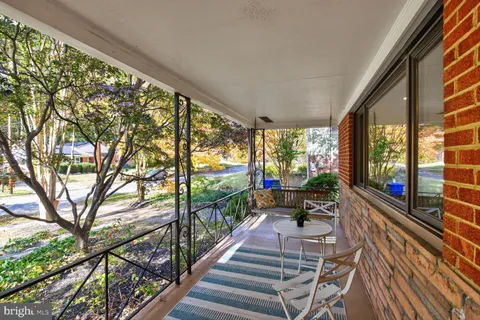 a view of balcony with furniture
