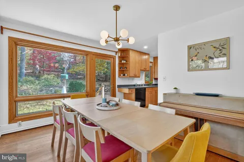 a view of a dining room with furniture window and outside view