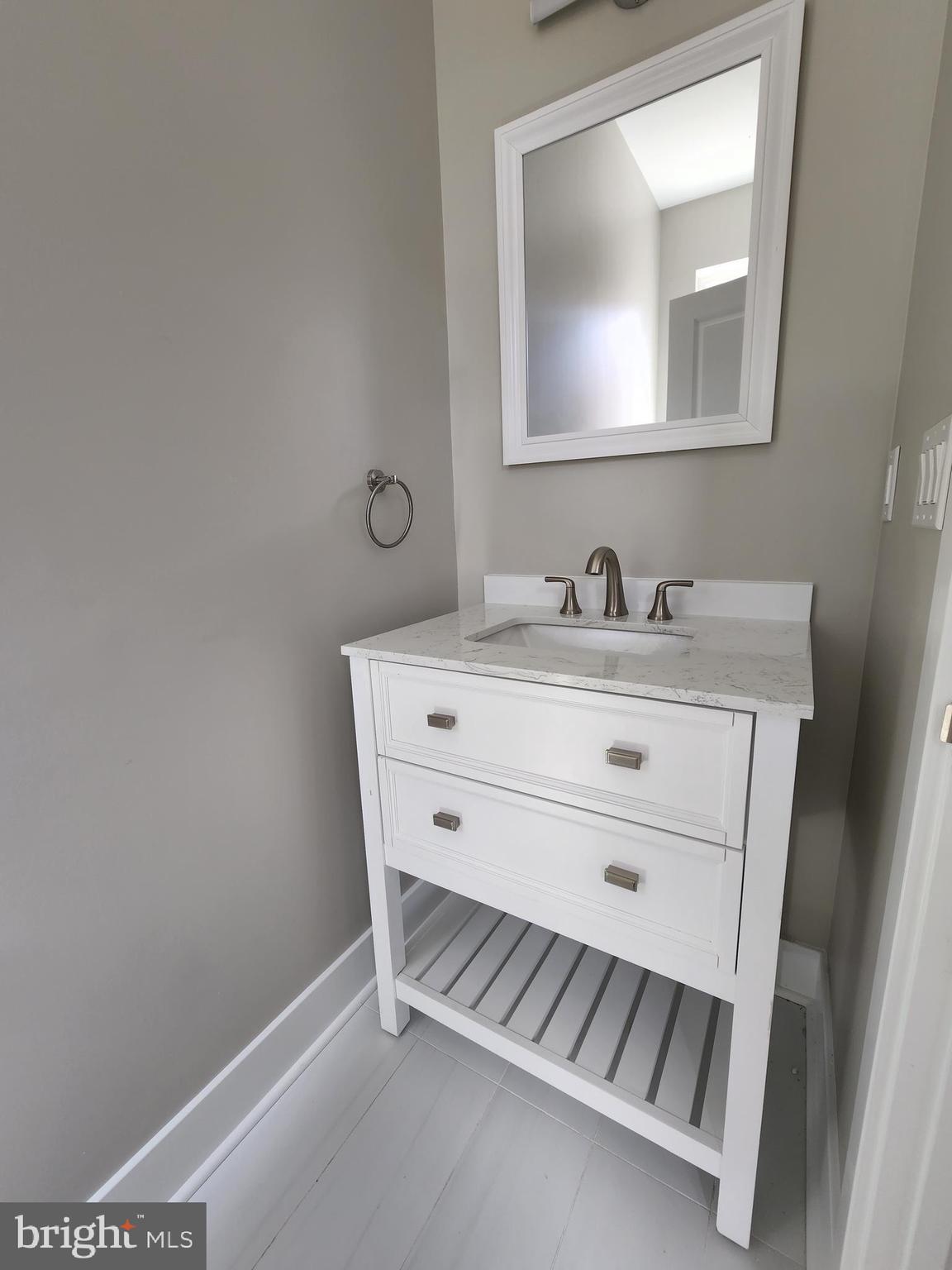 2449 Turner Street, Unit 2 Philadelphia, PA 19121 - Photo 7 of 24 a bathroom with a sink and a mirror