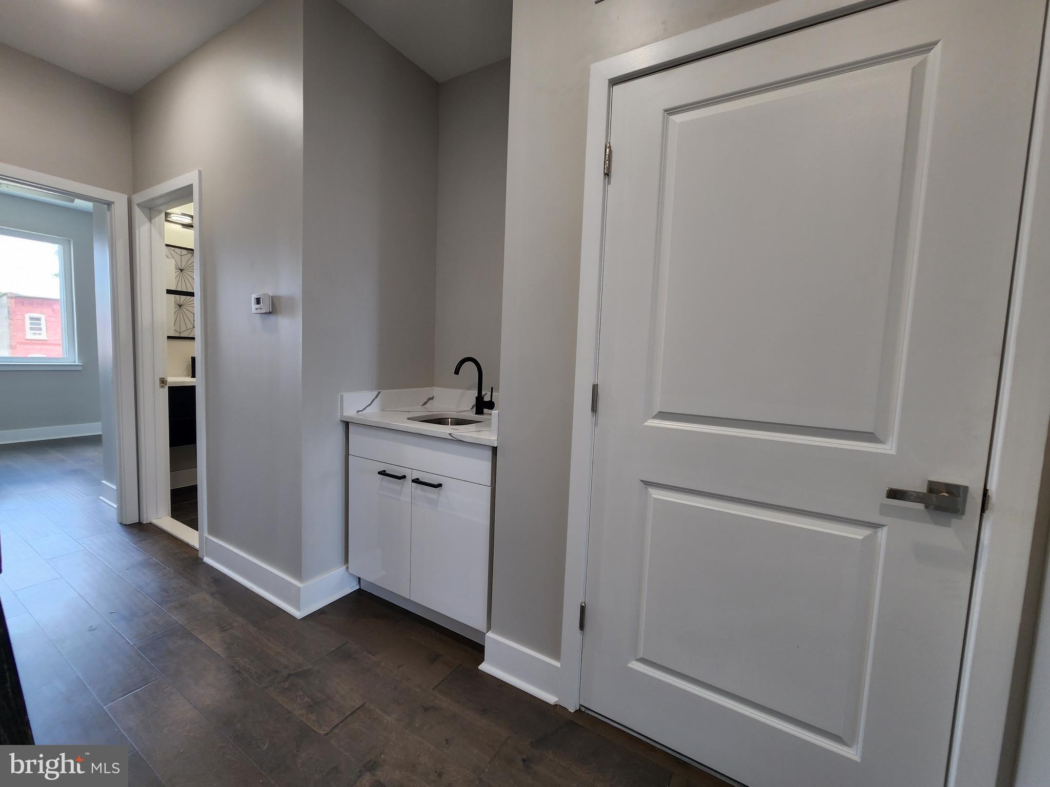 2449 Turner Street, Unit 2 Philadelphia, PA 19121 - Photo 9 of 24 a view of a hallway with closet and wooden floor