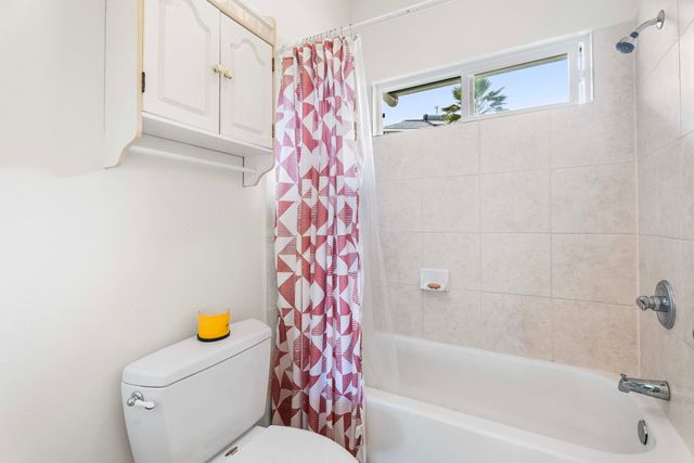 a bathroom with a sink and a shower curtain