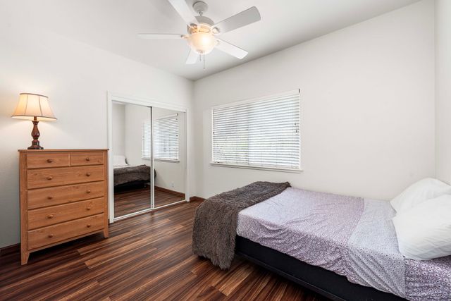 a bedroom with a bed and a dresser