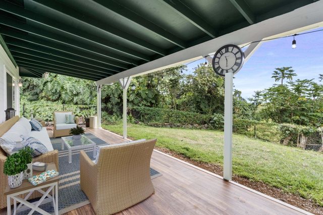 a view of a patio with garden