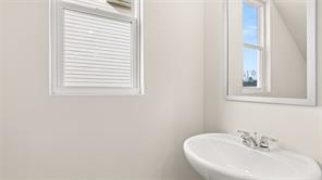 912 Stow Lane Monroe, GA 30655 - Photo 14 of 32 a bathroom with a sink and a window