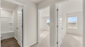 912 Stow Lane Monroe, GA 30655 - Photo 18 of 32 a view of a bathroom from a hallway with toilet