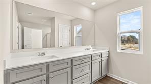 912 Stow Lane Monroe, GA 30655 - Photo 24 of 32 a bathroom with a sink and a mirror