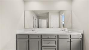 912 Stow Lane Monroe, GA 30655 - Photo 26 of 32 a bathroom with a sink and a mirror