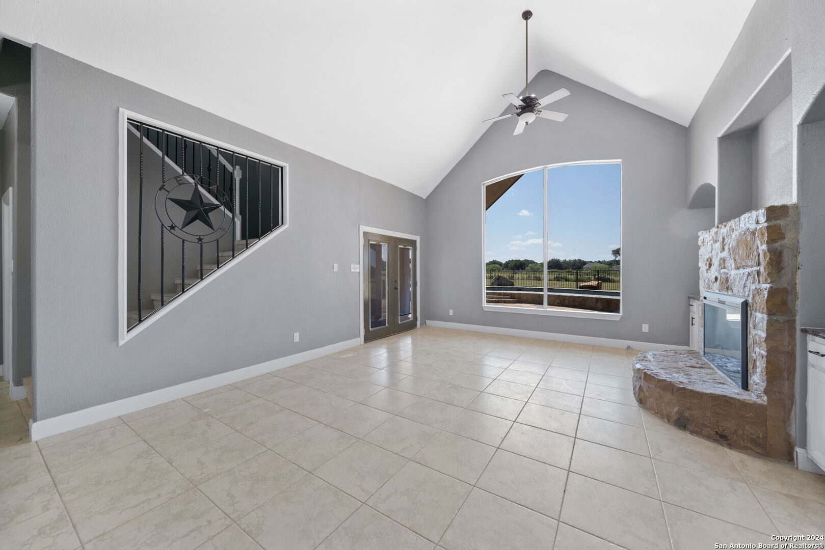 3022 Interstate 35 Natalia, TX 78059 - Photo 13 of 49 a view of an empty room with a fireplace and a window