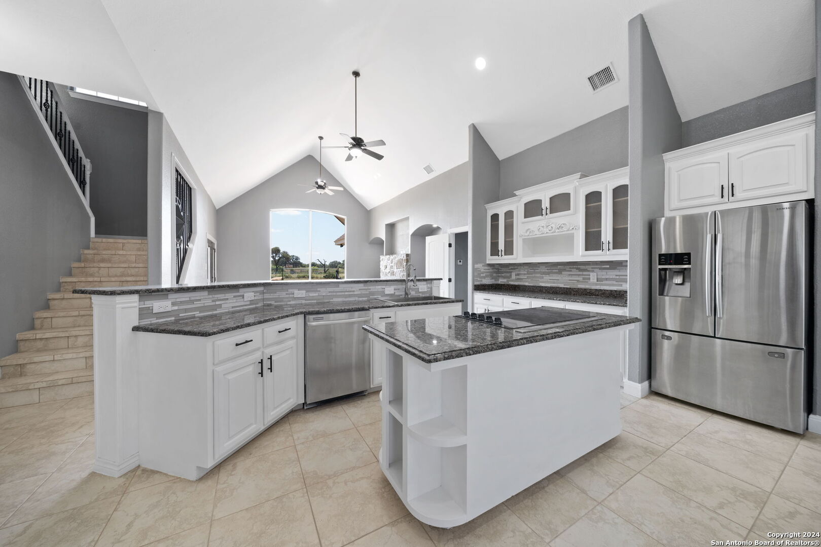 3022 Interstate 35 Natalia, TX 78059 - Photo 16 of 49 a kitchen with stainless steel appliances granite countertop a sink and a refrigerator