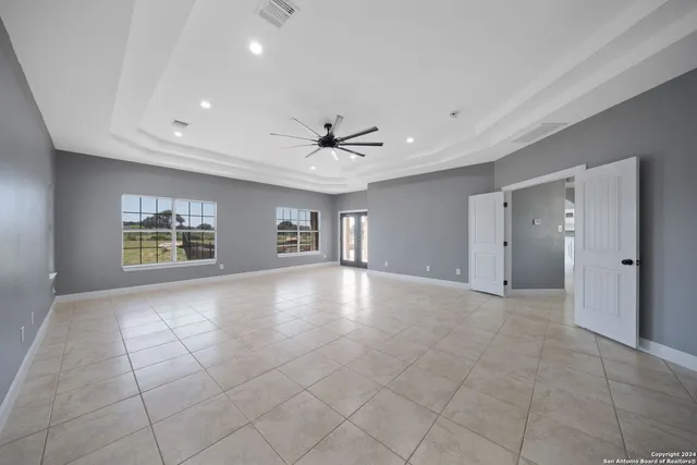 a bathroom with a granite countertop sink mirror and shower