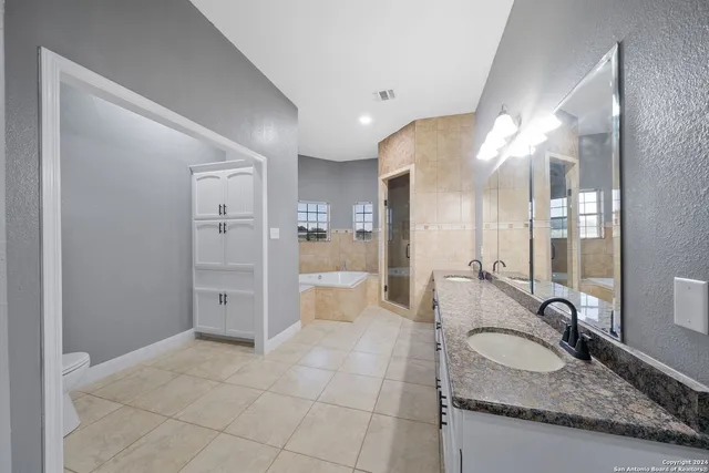 a bathroom with a bathtub and shower