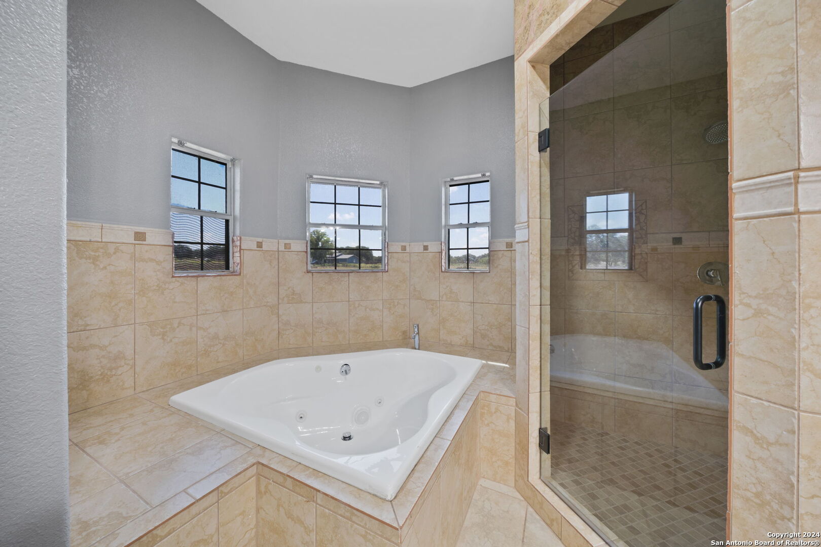 3022 Interstate 35 Natalia, TX 78059 - Photo 24 of 49 a bathroom with a bathtub and shower
