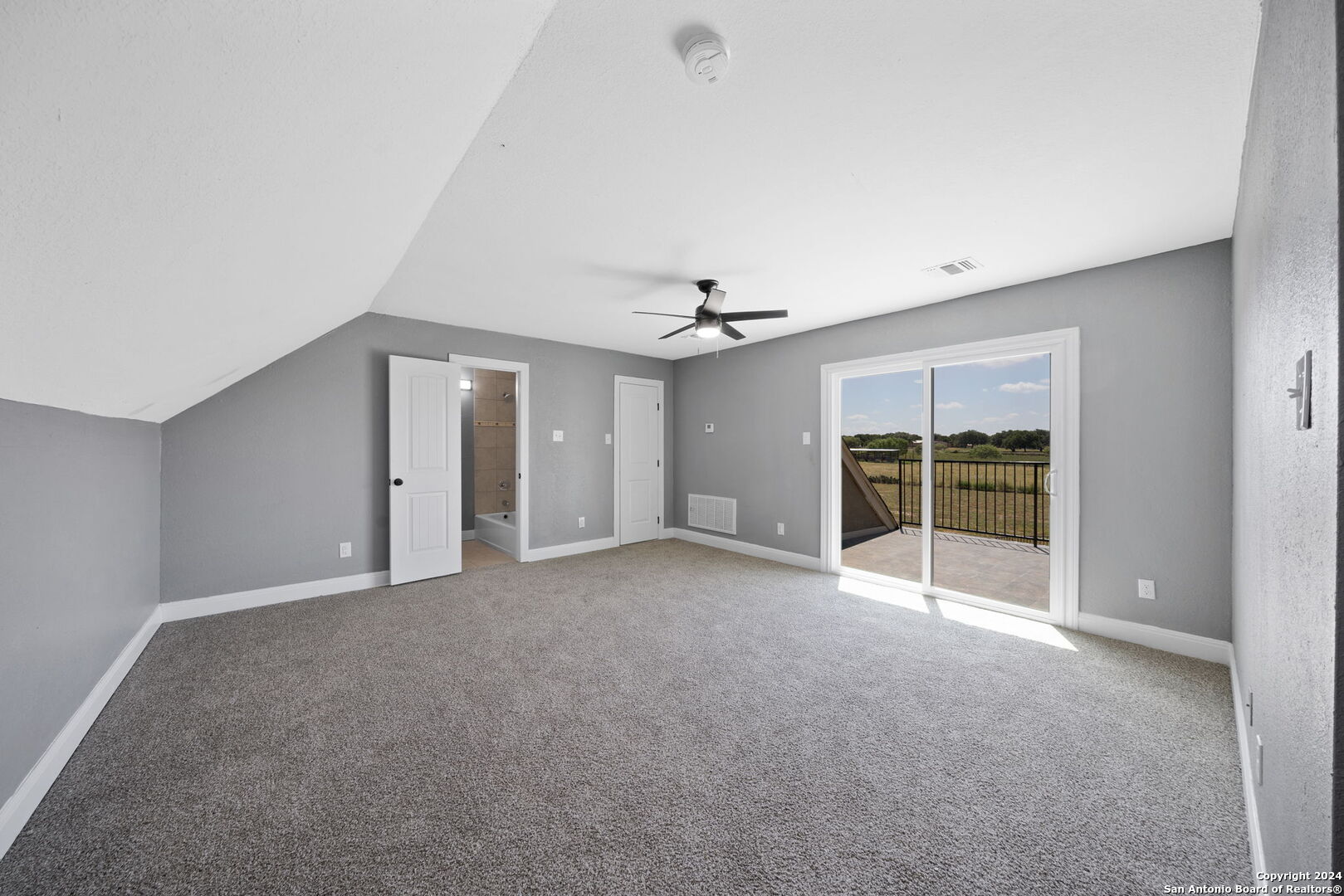 3022 Interstate 35 Natalia, TX 78059 - Photo 30 of 49 a view of an empty room with a window and cabinet