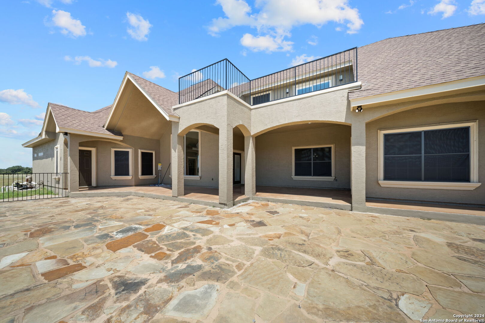 3022 Interstate 35 Natalia, TX 78059 - Photo 34 of 49 a view of a white house with a outdoor space