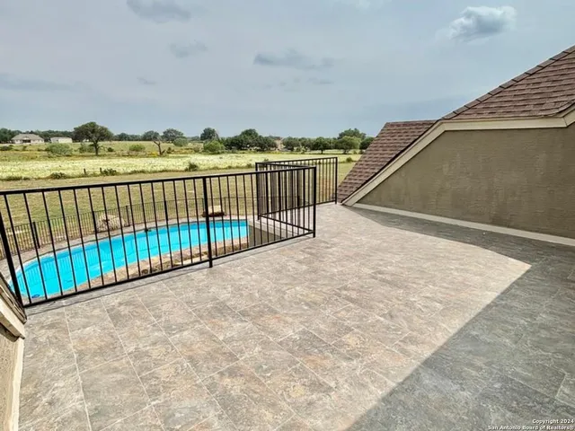 a view of a lake with houses in the back